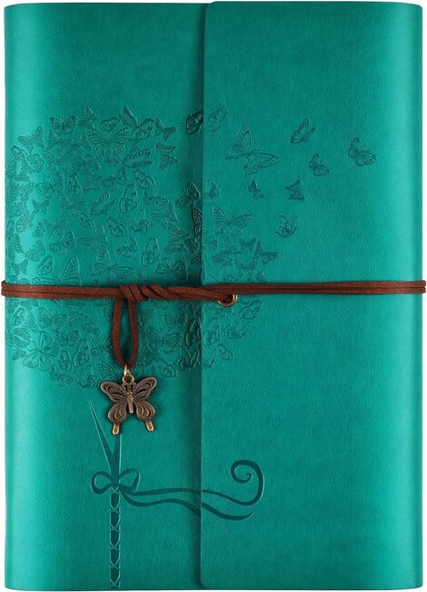 Blue OMEYA Leather Journal: Compact, refillable, lined notebook – perfect travel companion for women.